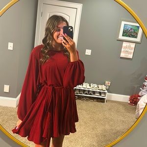 This is a beautiful Christmas dress made by Mittoshop! Is a small. Garnet color.